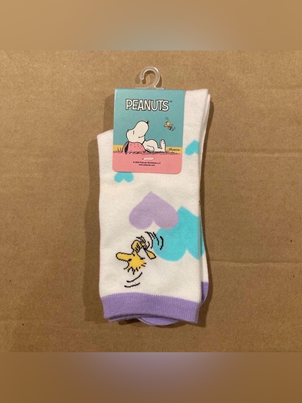 White Peanuts Snoopy socks with purple and blue hearts